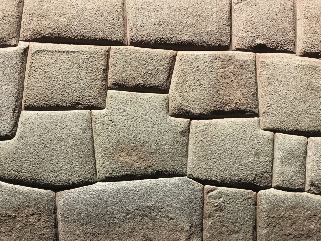 A close view of Inca stonework, large blocks cut to fit each other without mortar.